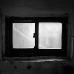 Closed window in abandoned building