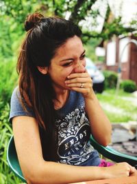 Portrait of a girl sitting outdoors