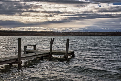 Pier on sea against sky