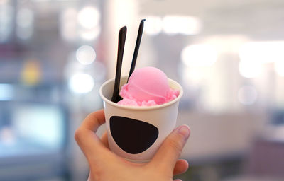 Close-up of hand holding ice cream