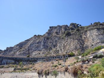 Scenic view of mountains against clear blue sky