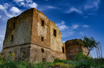 Low angle view of historical building against sky