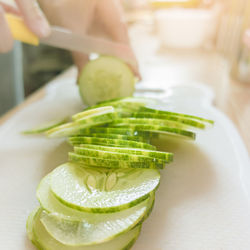 Close-up of hand holding juice