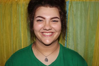 Close-up portrait of smiling young woman