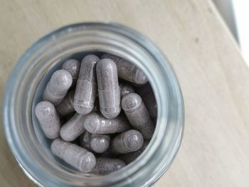 High angle view of candies in jar on table