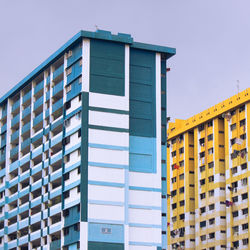 Low angle view of building against blue sky