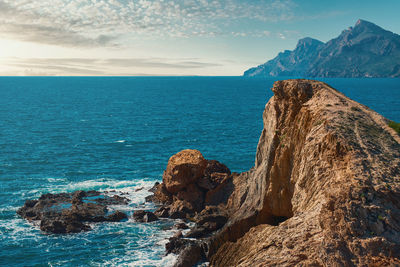 Scenic view of sea against blue sky