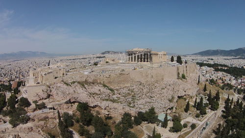 High angle view of ancient buildings against blue sky