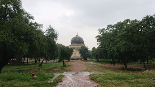 Trees in temple against sky