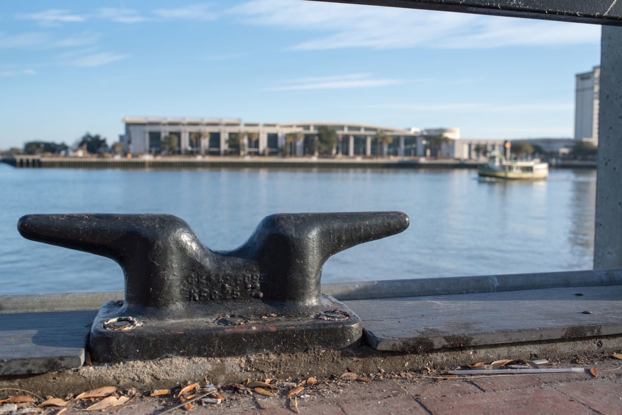 CLOSE-UP OF METAL GRATE AT HARBOR