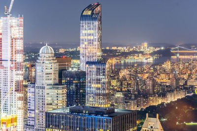 Illuminated buildings in city at night