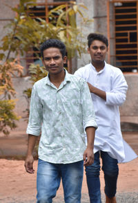 Portrait of young man standing outdoors
