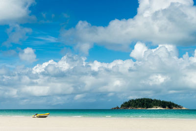 Scenic view of sea against cloudy sky