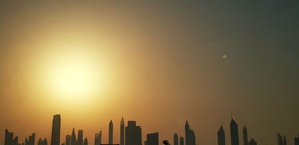 View of buildings against sky during sunset