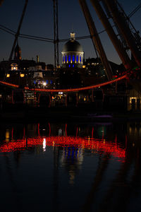 Illuminated buildings at waterfront