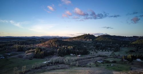 Scenic view of landscape against sky during sunset