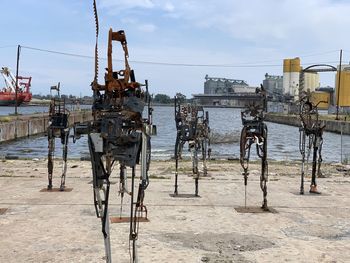 View of horse cart on land against sky