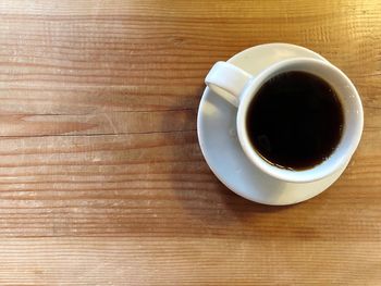 High angle view of black coffee on table