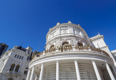 Low angle view of historical building against blue sky