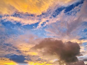 Low angle view of dramatic sky during sunset