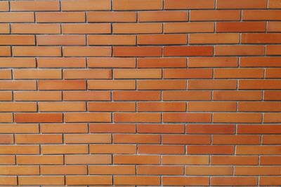 Full frame shot of orange brick wall