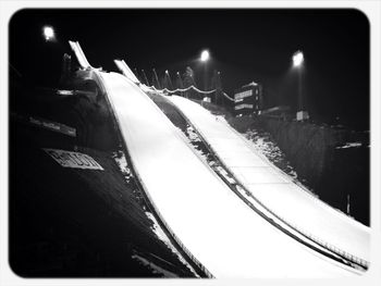 Snow covered road at night