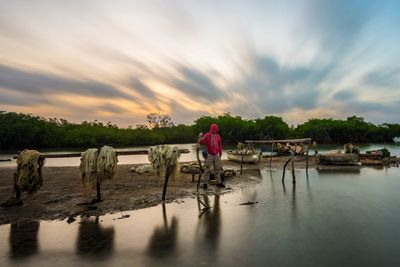 Scenic view of sea against sky at sunset