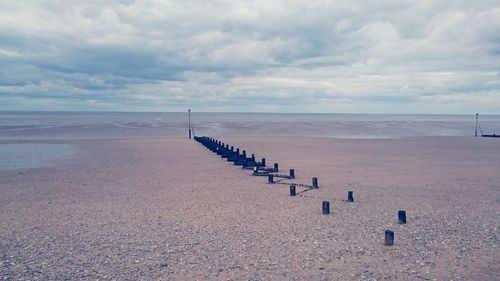 Scenic view of sea against cloudy sky