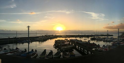 Boats moored by river