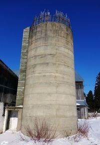 Low angle view of built structure against blue sky