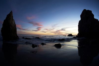 Scenic view of sea against sky at sunset