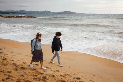 Rear view of women on beach