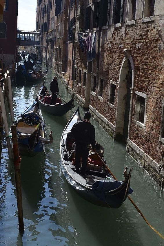 architecture, building exterior, water, built structure, waterfront, nautical vessel, men, lifestyles, boat, canal, person, transportation, leisure activity, large group of people, city, mode of transport, river, tourist, travel