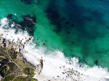 High angle view of rocks in sea