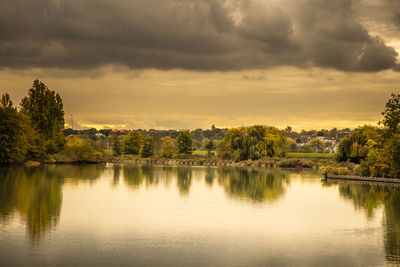 Scenic view of lake against sky during sunset