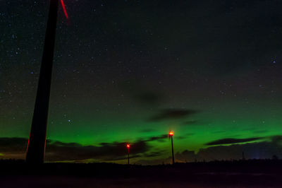 Scenic view of landscape against sky at night