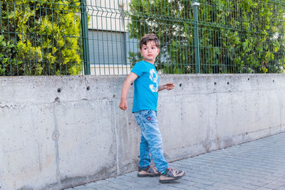 Full length portrait of boy standing outdoors