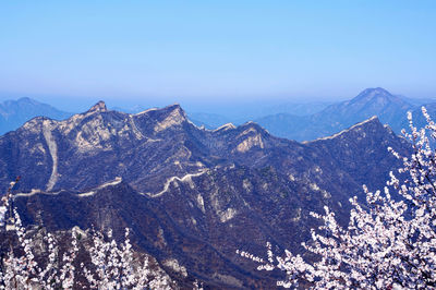 Scenic view of snowcapped mountains against clear sky