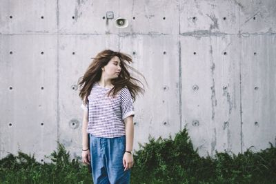 Beautiful woman standing in the dark