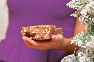 Close-up of hand holding ice cream cone