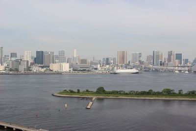 Scenic view of sea and buildings against sky