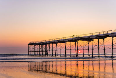 Scenic view of sea against clear sky during sunset