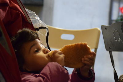 Close-up of girl holding camera