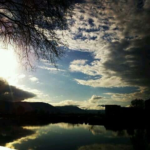 water, sky, reflection, tranquil scene, lake, tranquility, cloud - sky, silhouette, scenics, sunset, beauty in nature, waterfront, tree, cloud, nature, cloudy, idyllic, river, dusk, mountain