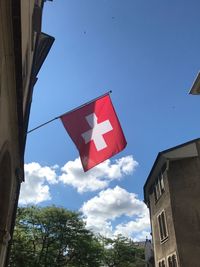 Low angle view of flag against sky