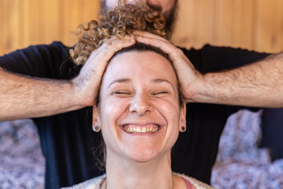 Close-up portrait of smiling young woman