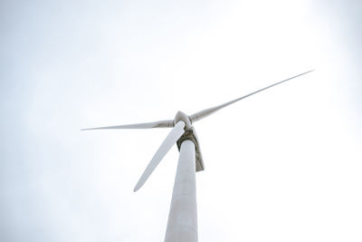 Low angle view of wind turbine against sky