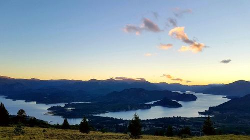 Scenic view of mountains against sky at sunset