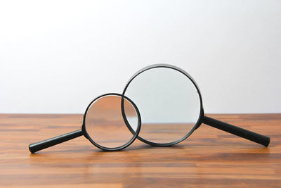 Close-up of eyeglasses on table against white background