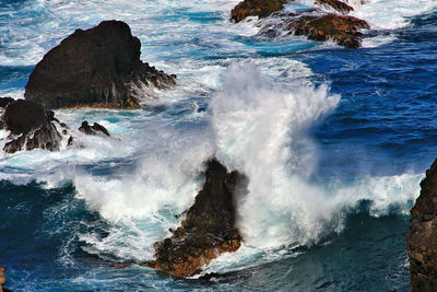 Scenic view of sea waves splashing